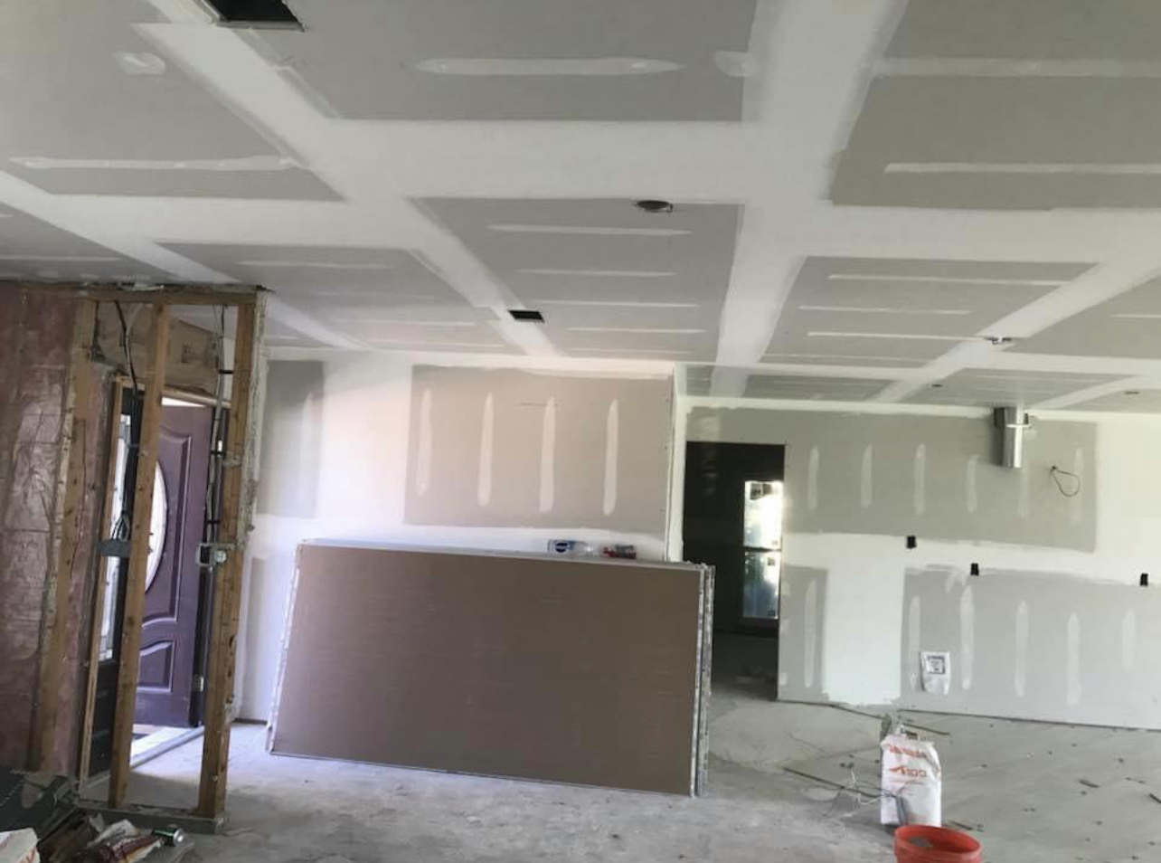Drywall installation with taped joints on ceiling and walls in Lake County residential project